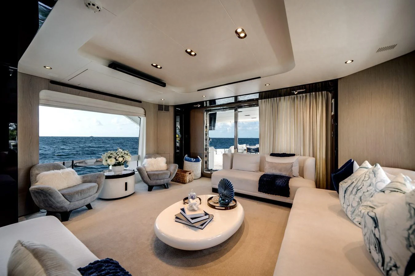 The salon offers a luxurious and spacious seating area with panoramic ocean views. aboard PIER PRESSURE Yacht for Sale