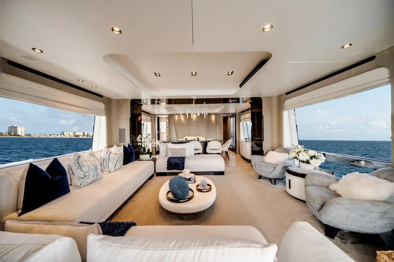 The spacious salon offers luxurious seating with panoramic ocean views. aboard PIER PRESSURE Yacht for Sale