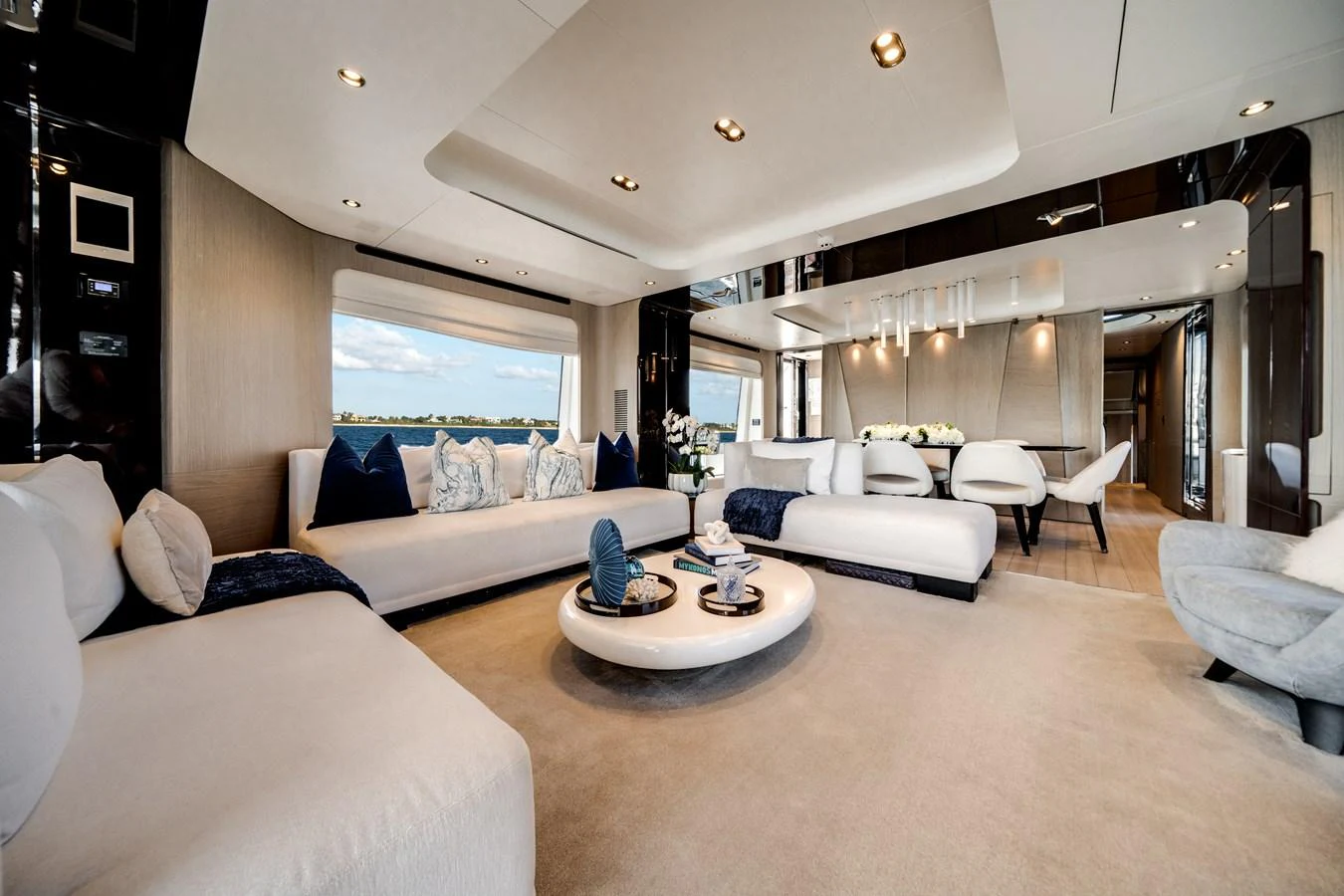 The spacious salon features elegant seating and a modern, open design with ample natural light. aboard PIER PRESSURE Yacht for Sale