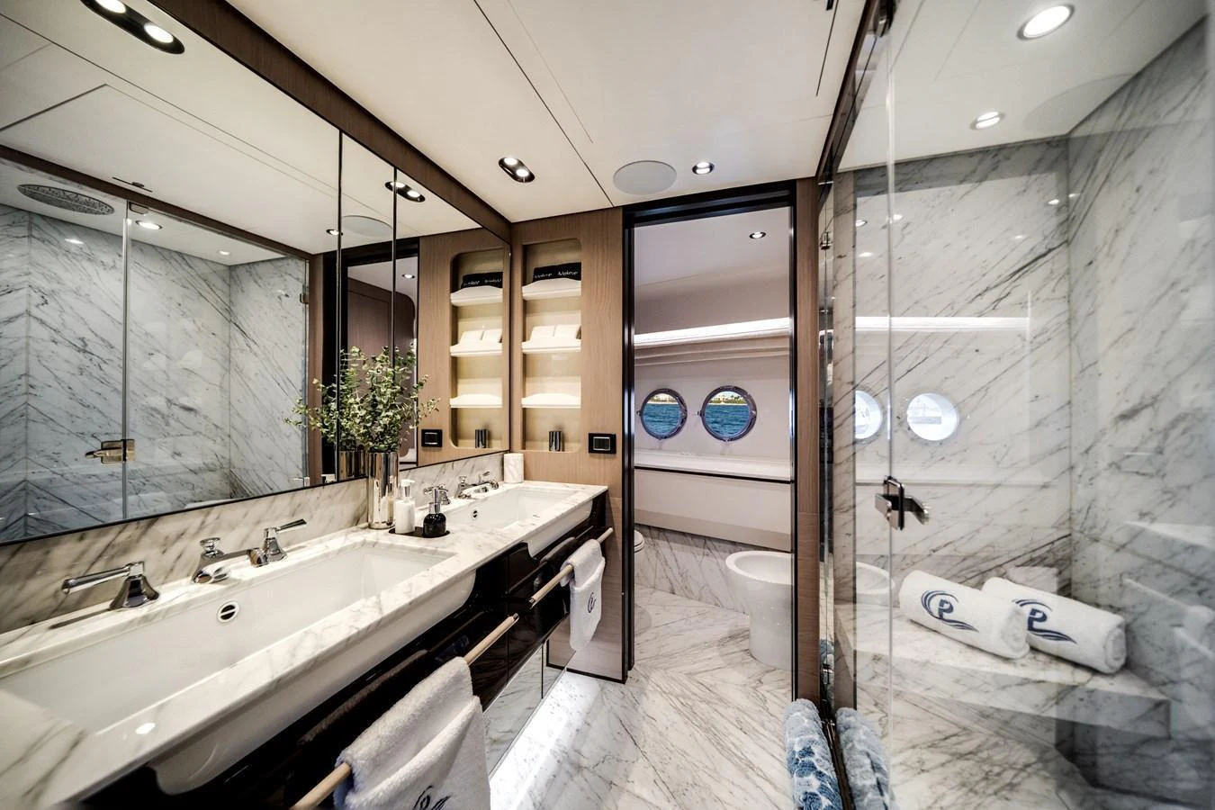 A luxurious yacht bathroom featuring elegant marble finishes and modern fixtures. aboard PIER PRESSURE Yacht for Sale