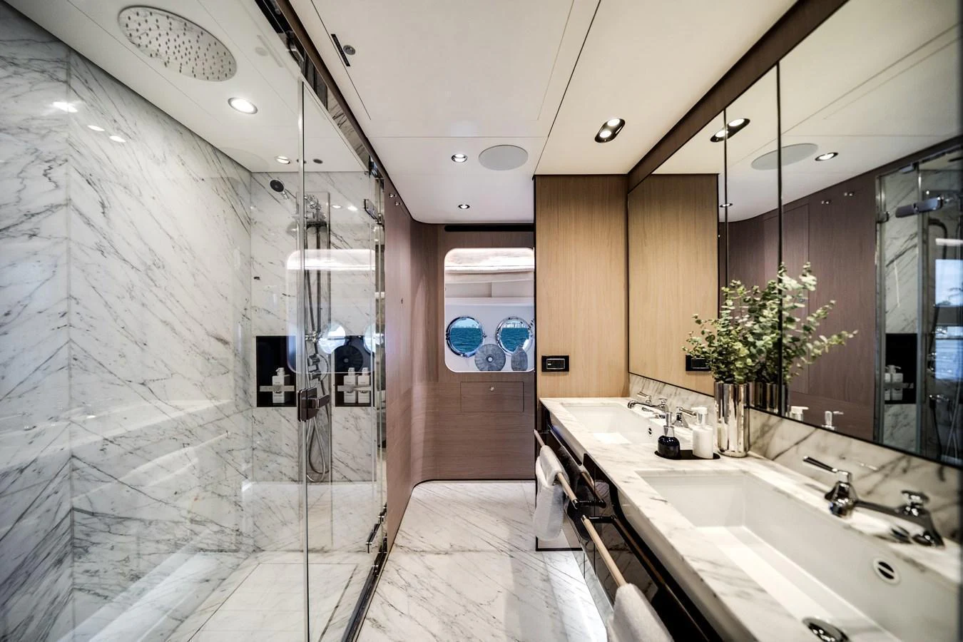 The yacht's bathroom features luxurious marble finishes and modern fixtures. aboard PIER PRESSURE Yacht for Sale