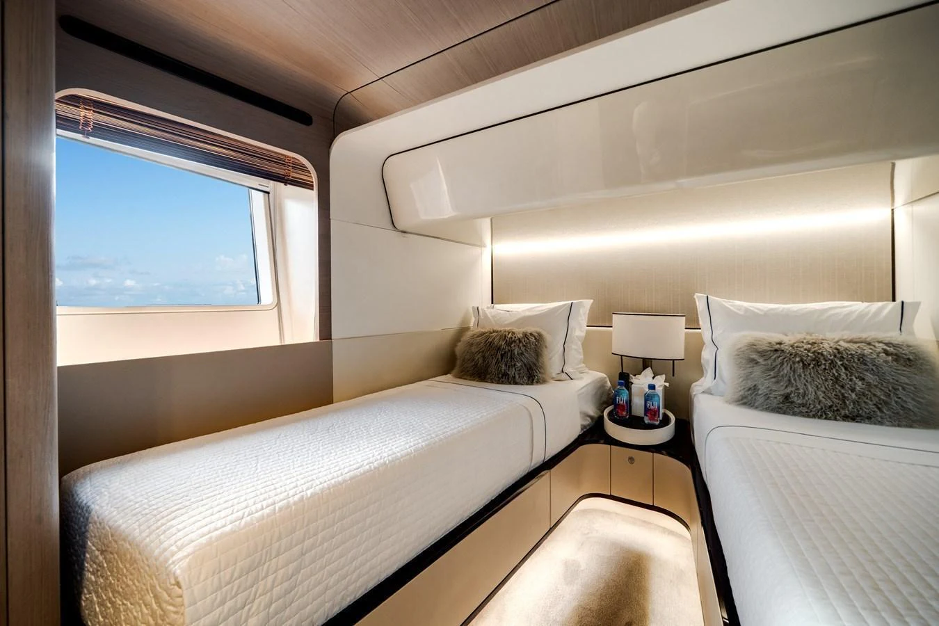 The twin stateroom offers a cozy and inviting space with two single beds and a view of the sea. aboard PIER PRESSURE Yacht for Sale