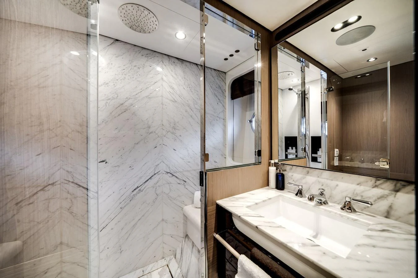 The yacht's bathroom features elegant marble surfaces and modern fixtures, creating a luxurious and serene atmosphere. aboard PIER PRESSURE Yacht for Sale