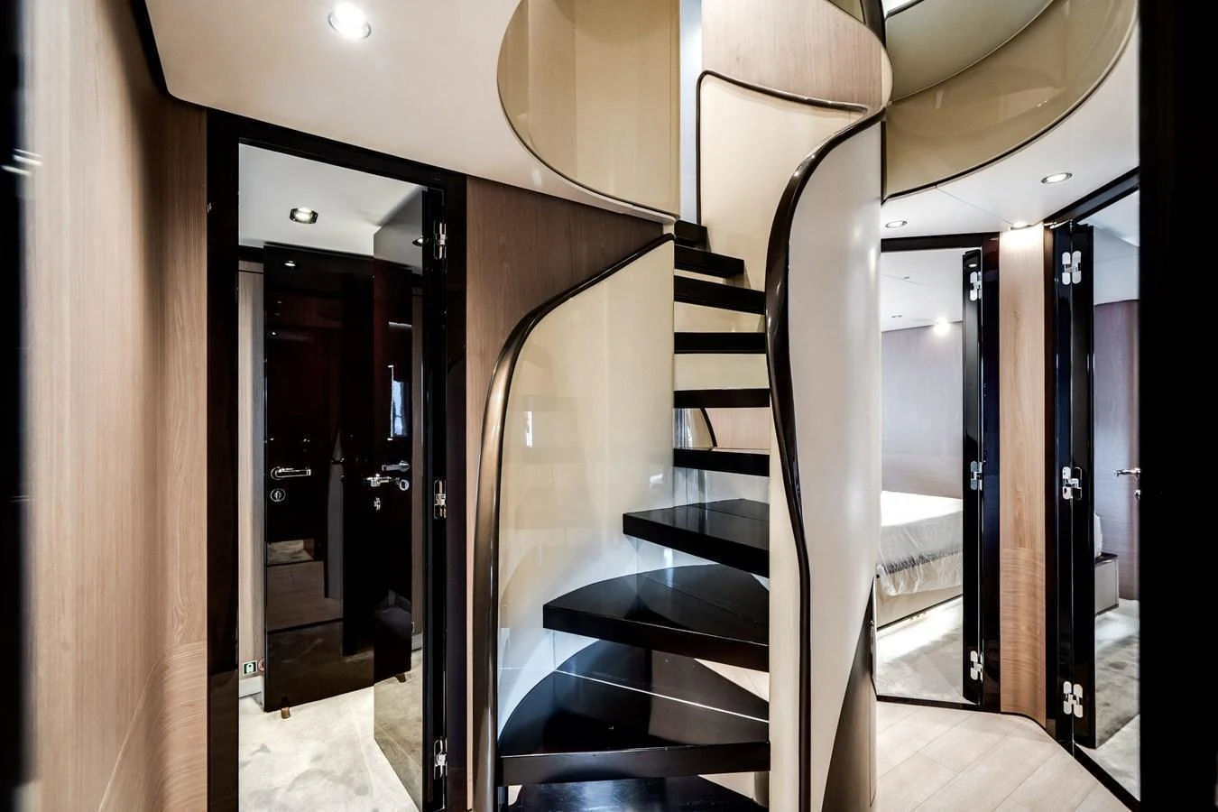 A sleek and modern interior staircase with elegant design elements. aboard PIER PRESSURE Yacht for Sale