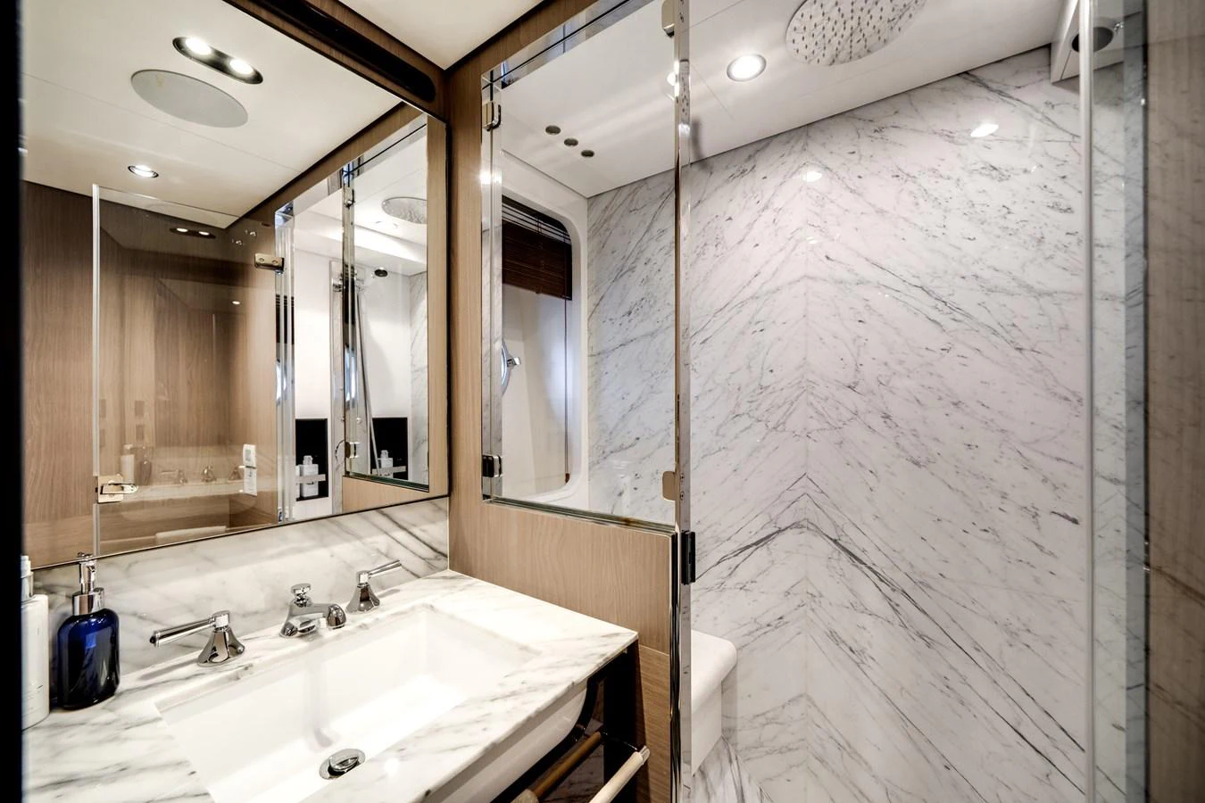 The yacht's bathroom features elegant marble surfaces and modern fixtures. aboard PIER PRESSURE Yacht for Sale