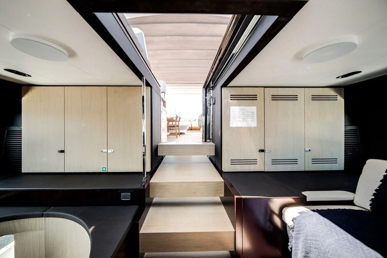 The interior of the yacht features a modern design with light wood finishes and ample natural light. aboard PIER PRESSURE Yacht for Sale