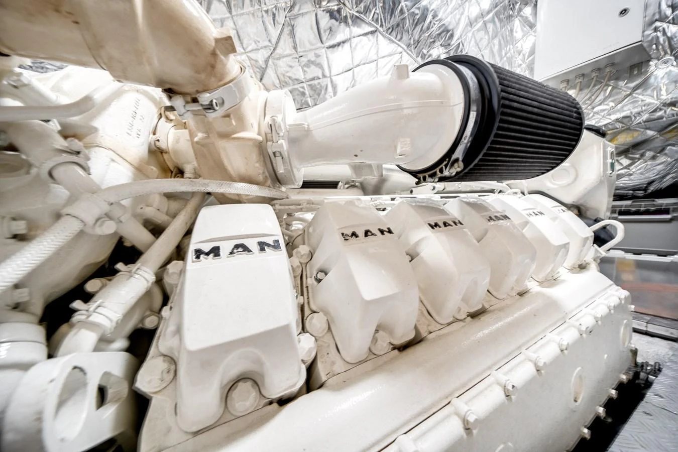 The image showcases the powerful engine room of the yacht, highlighting the advanced machinery. aboard PIER PRESSURE Yacht for Sale