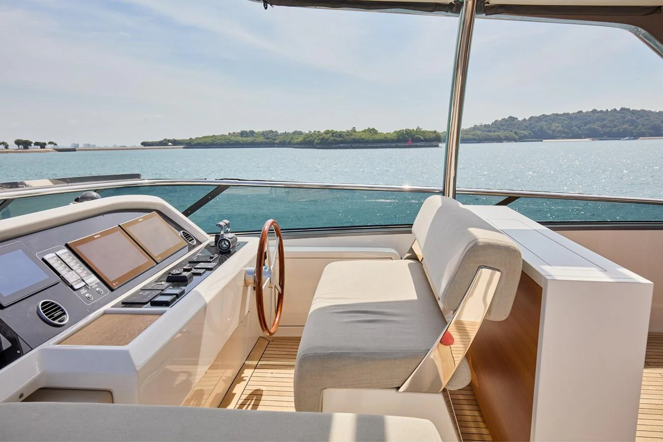 The helm station offers a sleek and modern design with a comfortable seating area and state-of-the-art navigation equipment. aboard TNT LEISURE Yacht for Sale