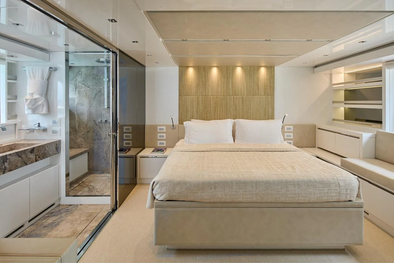 The master stateroom features a luxurious bed, modern decor, and an en-suite bathroom. aboard TNT LEISURE Yacht for Sale