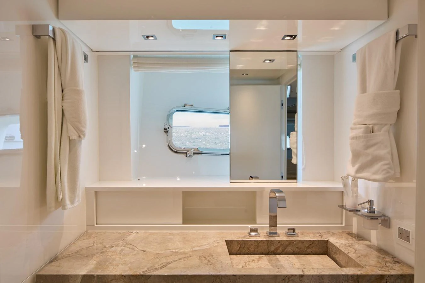 The yacht's bathroom features a sleek design with a marble countertop and modern fixtures. aboard TNT LEISURE Yacht for Sale
