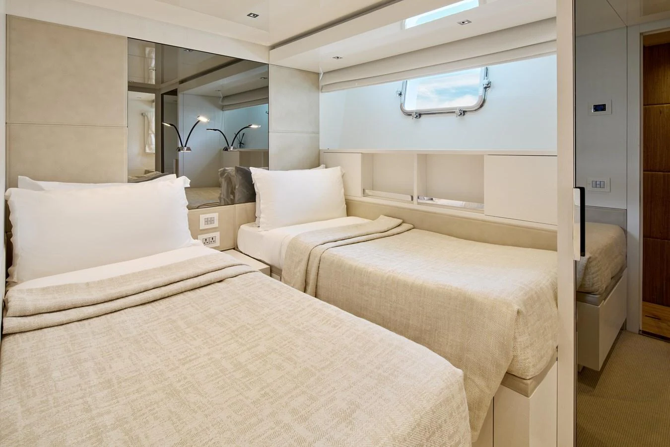 The guest stateroom features twin beds with luxurious linens and a serene ambiance. aboard TNT LEISURE Yacht for Sale