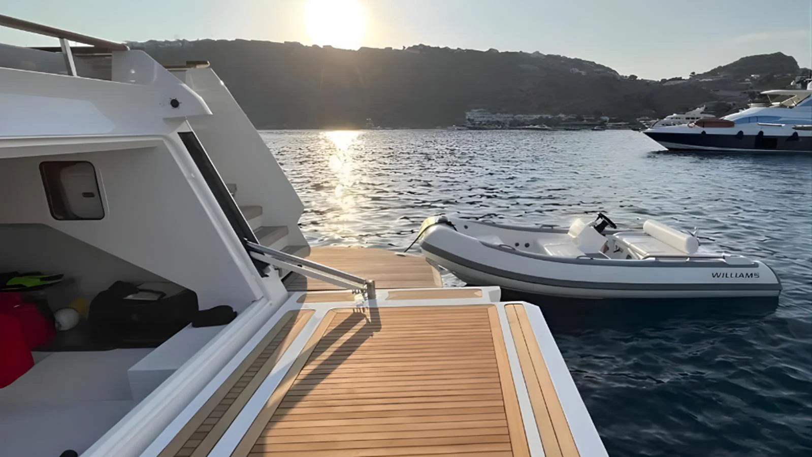 A sleek tender is docked beside the yacht, ready for exploration. aboard MARCH SUNRISE Yacht for Sale