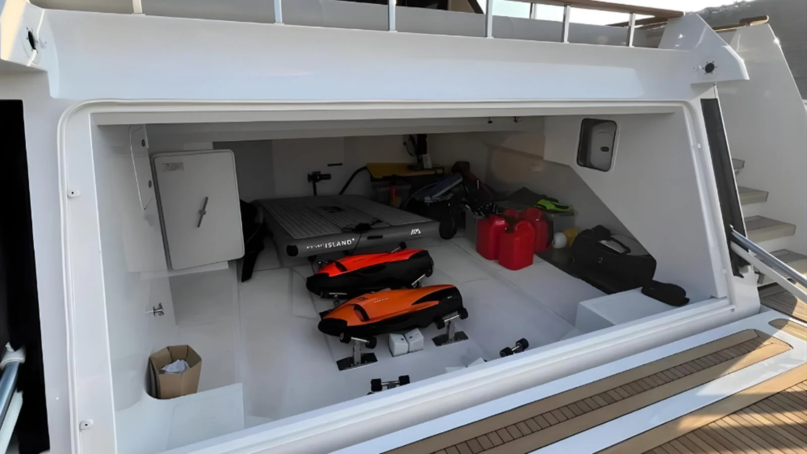 The yacht's toy garage is well-equipped with various water sports equipment and storage space. aboard MARCH SUNRISE Yacht for Sale