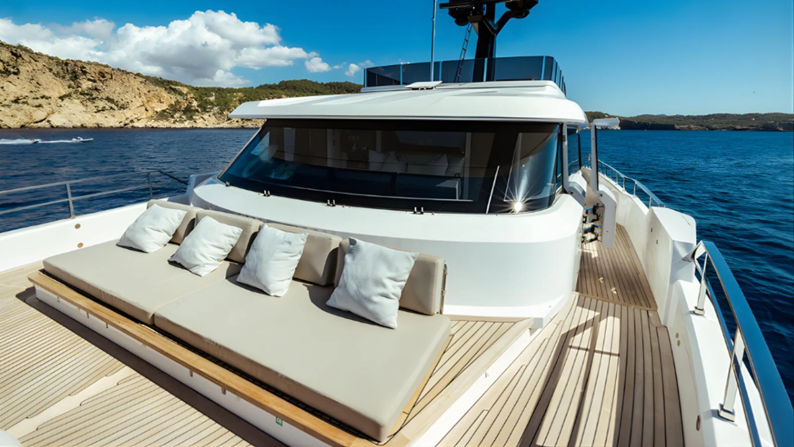 The foredeck features a spacious sunbathing area with plush cushions, perfect for relaxation. aboard MARCH SUNRISE Yacht for Sale