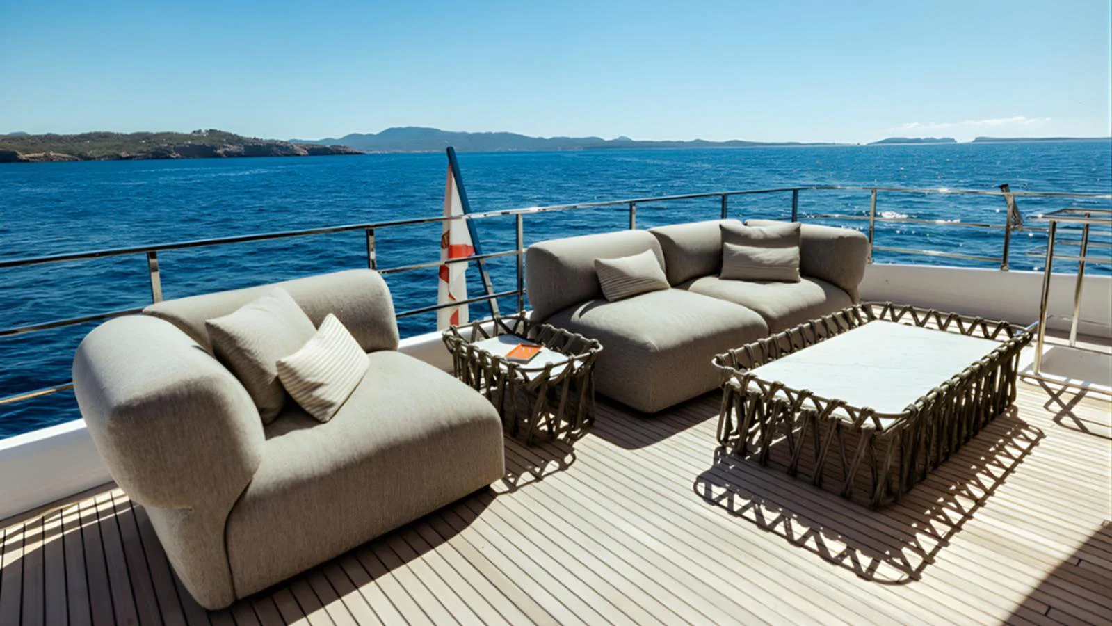 The aft deck features luxurious outdoor seating with stunning ocean views. aboard MARCH SUNRISE Yacht for Sale
