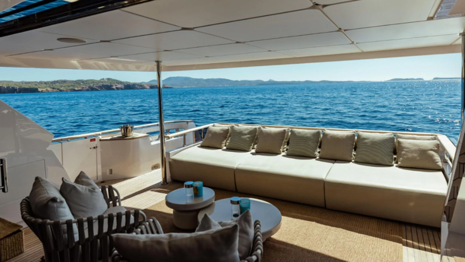 The aft deck offers a luxurious seating area with stunning ocean views. aboard MARCH SUNRISE Yacht for Sale