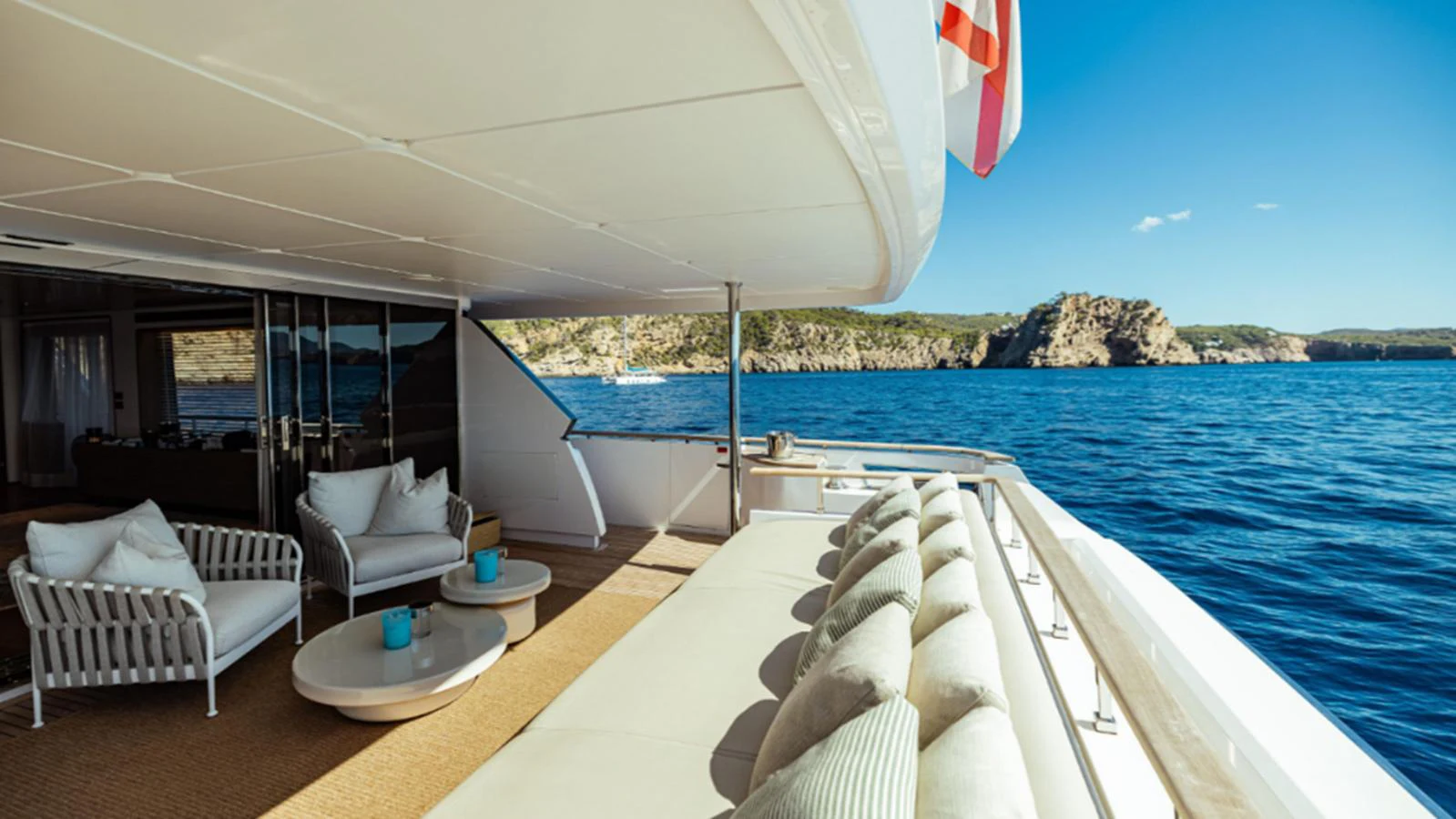 The aft deck offers a luxurious lounging area with stunning ocean views. aboard MARCH SUNRISE Yacht for Sale