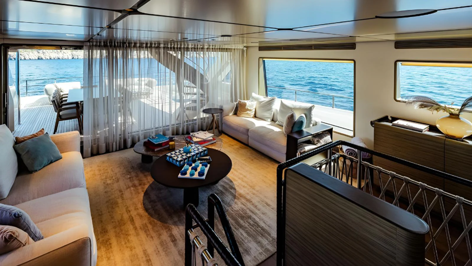 The salon offers a spacious and luxurious seating area with panoramic ocean views. aboard MARCH SUNRISE Yacht for Sale