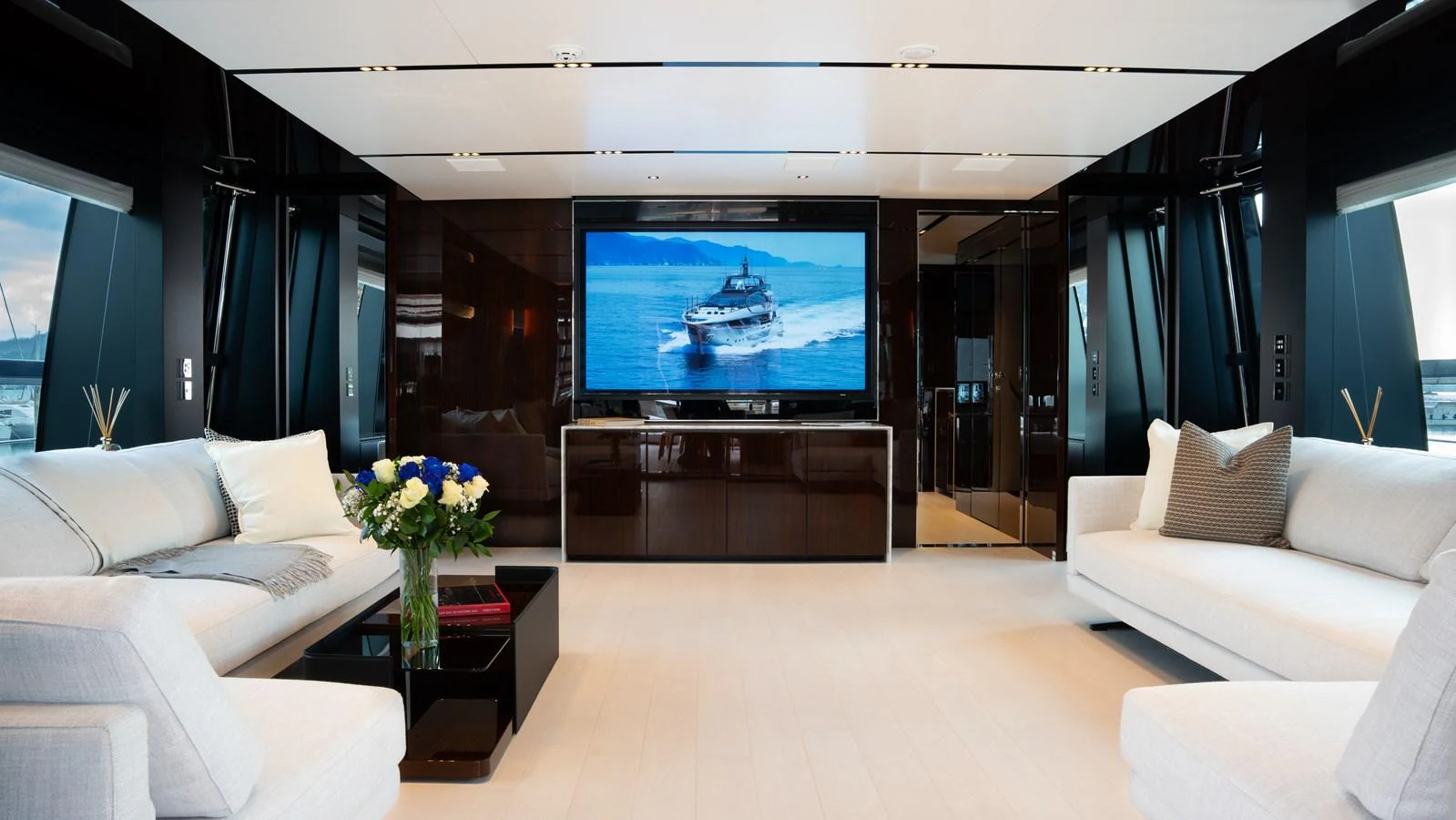 The salon features luxurious seating and a large flat-screen TV, creating an inviting space for relaxation and entertainment. aboard ´LANTE Yacht for Sale