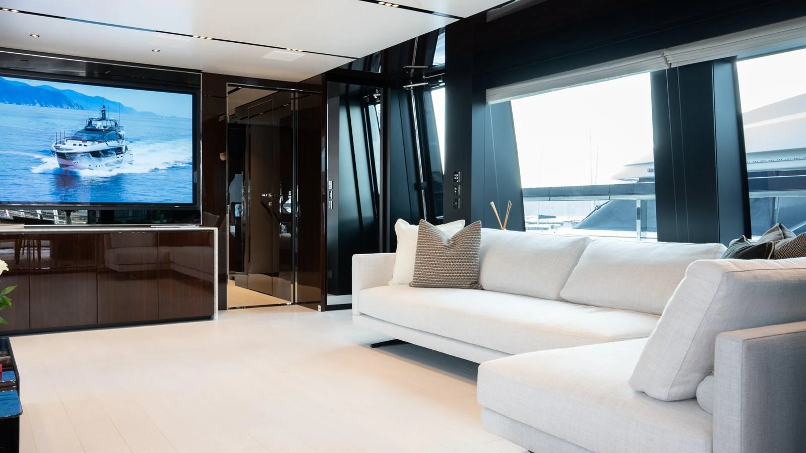 The salon features a spacious and modern seating area with large windows offering stunning views. aboard ´LANTE Yacht for Sale