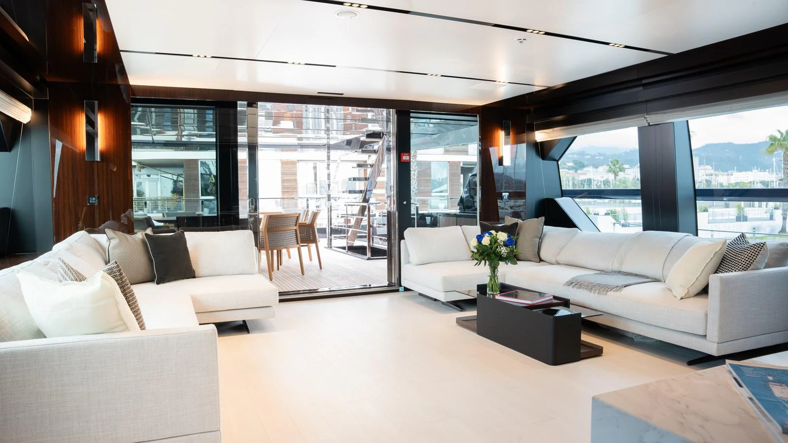 The salon features luxurious seating with a modern, open layout and large windows for natural light. aboard ´LANTE Yacht for Sale