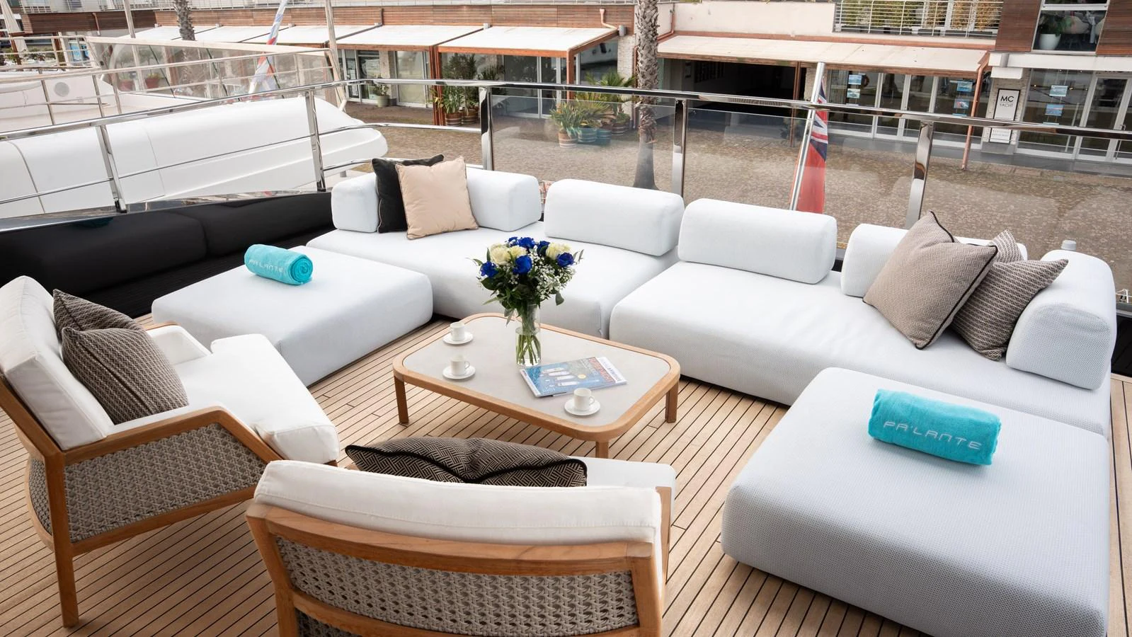 The aft deck features a comfortable seating area with plush cushions and a stylish coffee table, perfect for relaxation. aboard ´LANTE Yacht for Sale