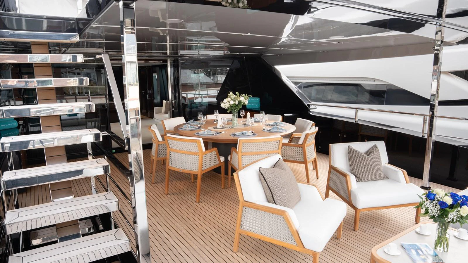 The aft deck features a stylish dining area with comfortable seating and elegant decor. aboard ´LANTE Yacht for Sale