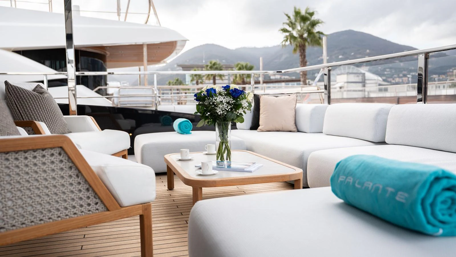 The aft deck features a luxurious seating area with plush cushions and a stylish coffee table, perfect for relaxation and socializing. aboard ´LANTE Yacht for Sale