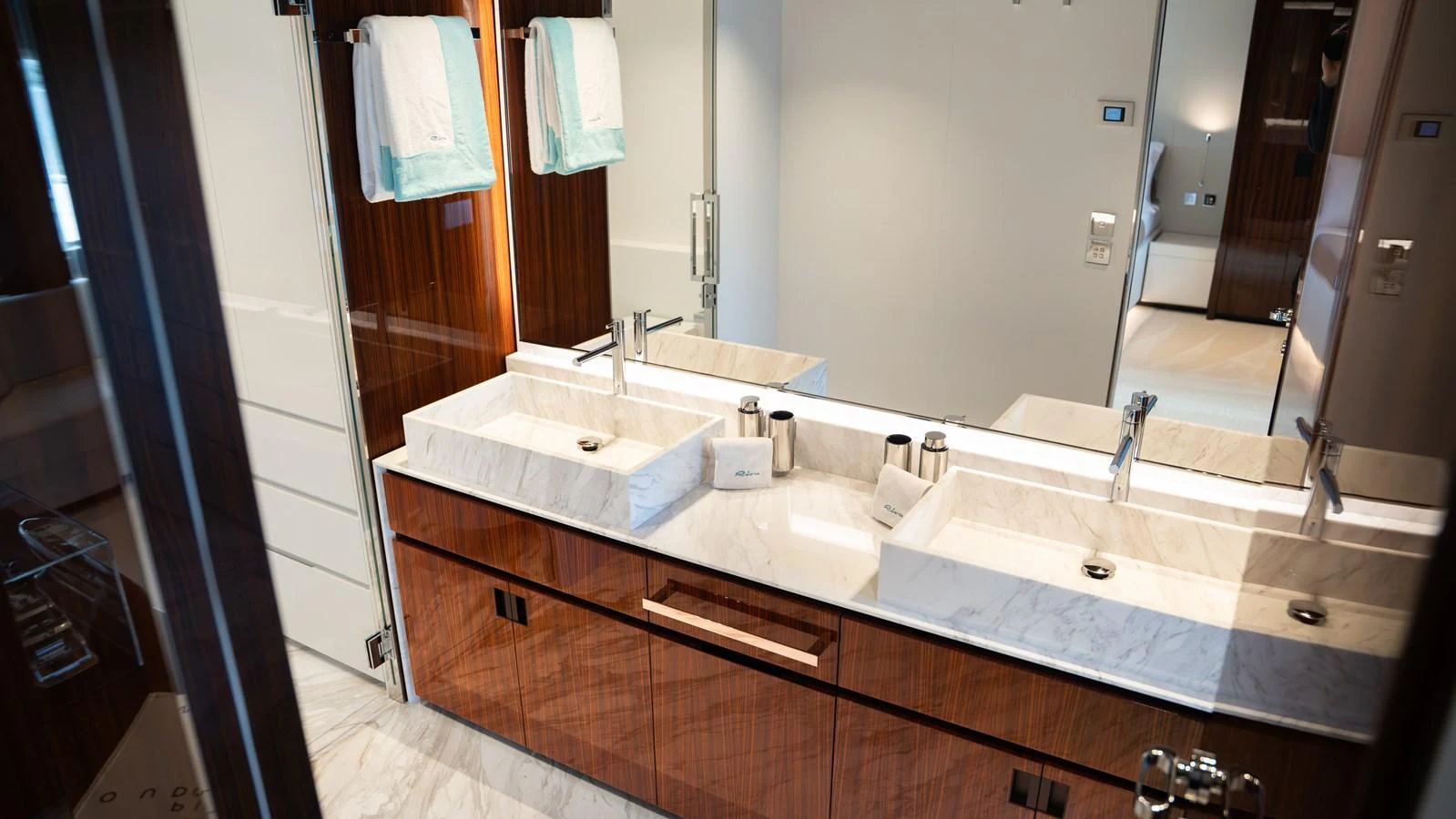 The bathroom features a luxurious double sink setup with elegant fixtures and ample mirror space. aboard ´LANTE Yacht for Sale