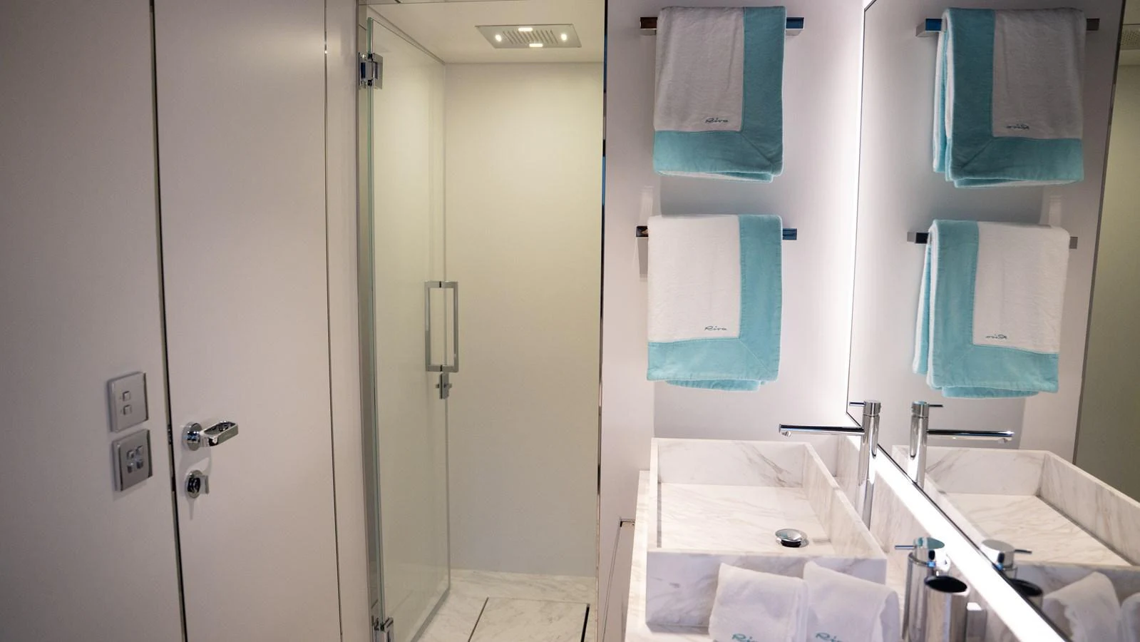The yacht's bathroom features a modern design with a glass shower and elegant fixtures. aboard ´LANTE Yacht for Sale