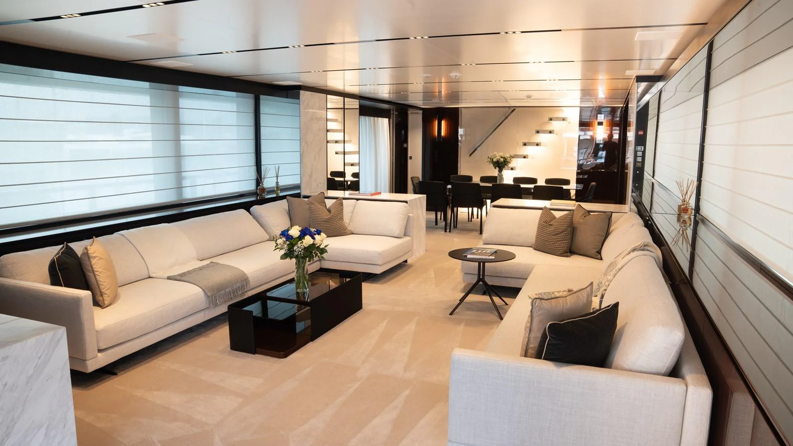 The yacht's salon features luxurious seating arrangements with modern decor and ample natural light. aboard ´LANTE Yacht for Sale
