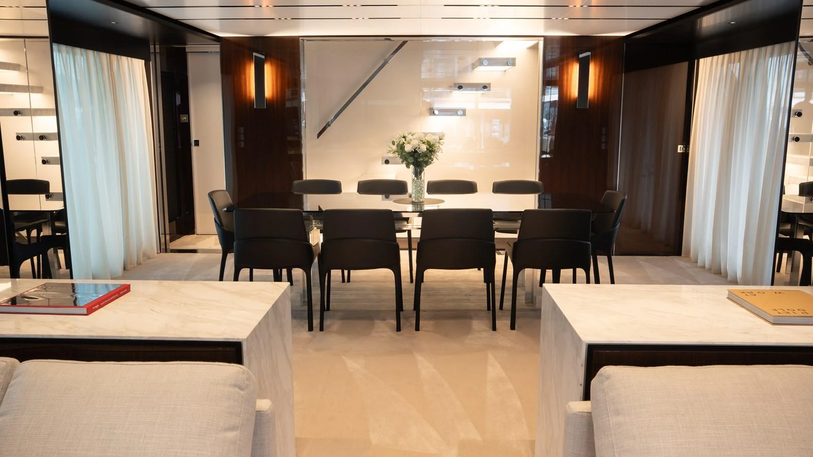 The yacht's dining area features a modern, elegant design with a large table and comfortable seating. aboard ´LANTE Yacht for Sale