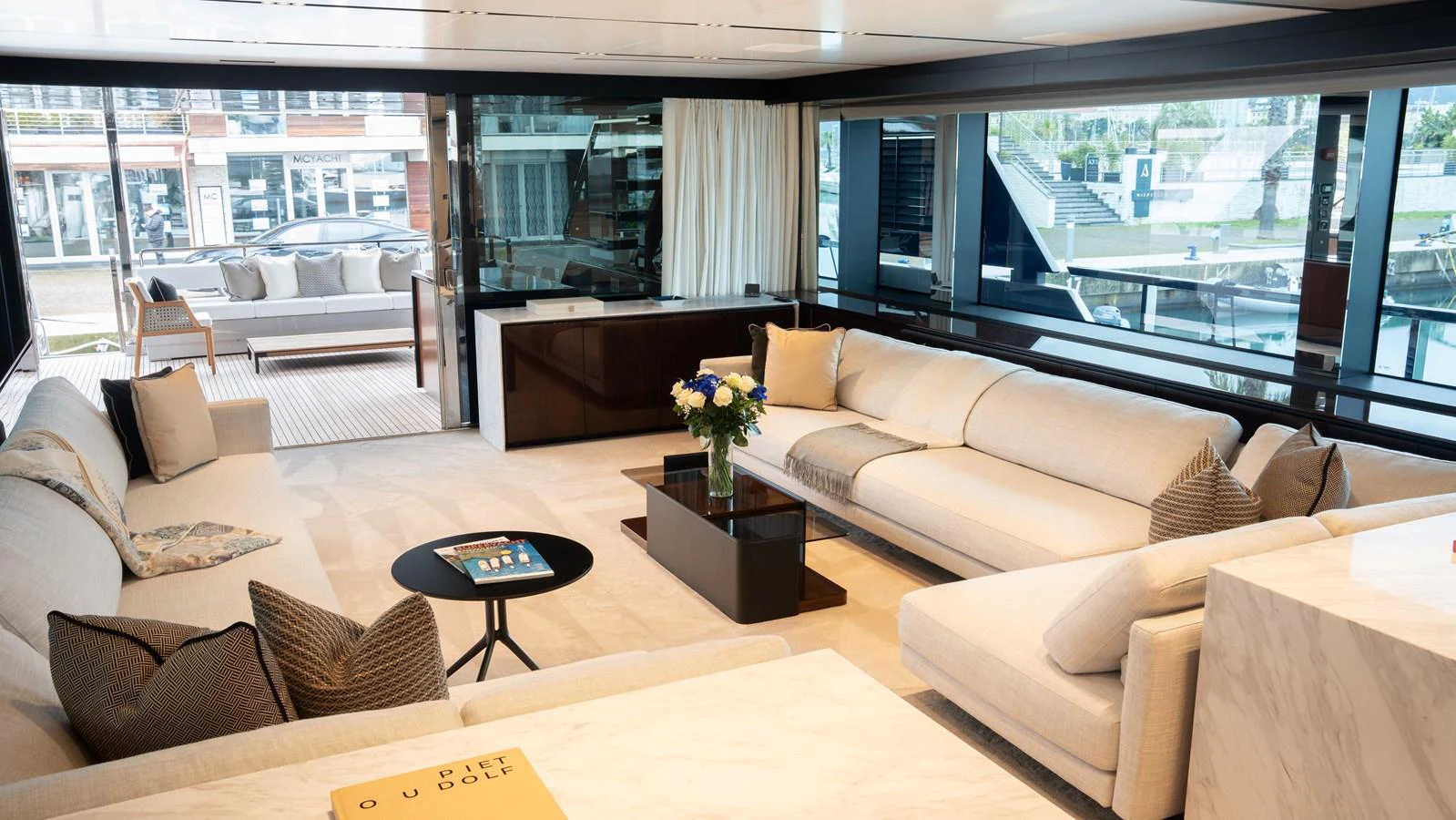The salon features luxurious seating with ample natural light and modern decor. aboard ´LANTE Yacht for Sale