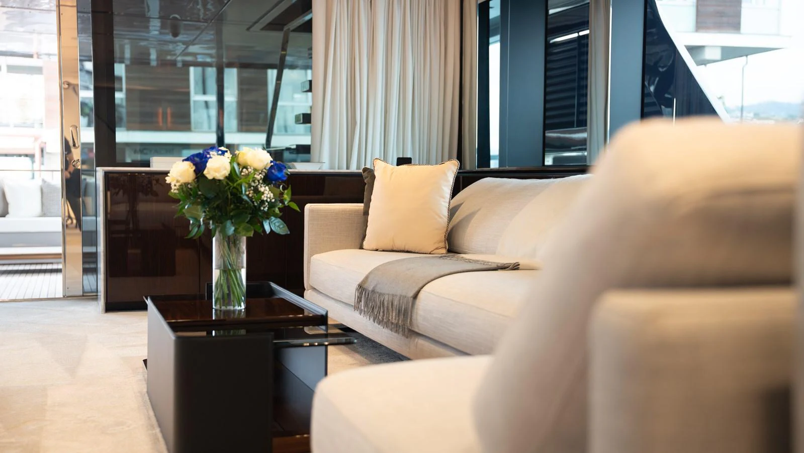 The yacht's interior features a luxurious seating area with a plush sofa and elegant decor. aboard ´LANTE Yacht for Sale