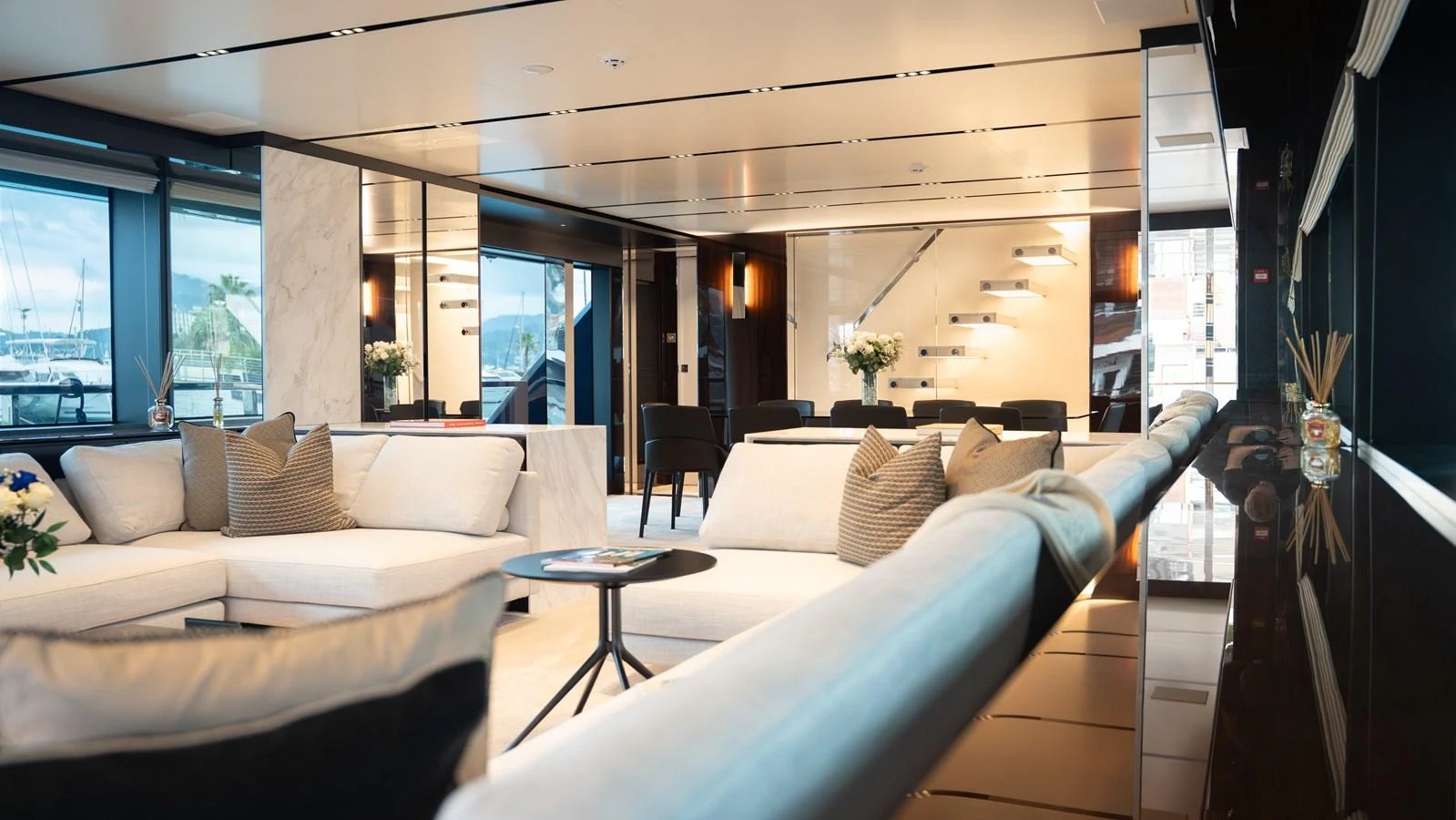The yacht's interior features a spacious and elegantly designed lounge area with modern furnishings and ample natural light. aboard ´LANTE Yacht for Sale