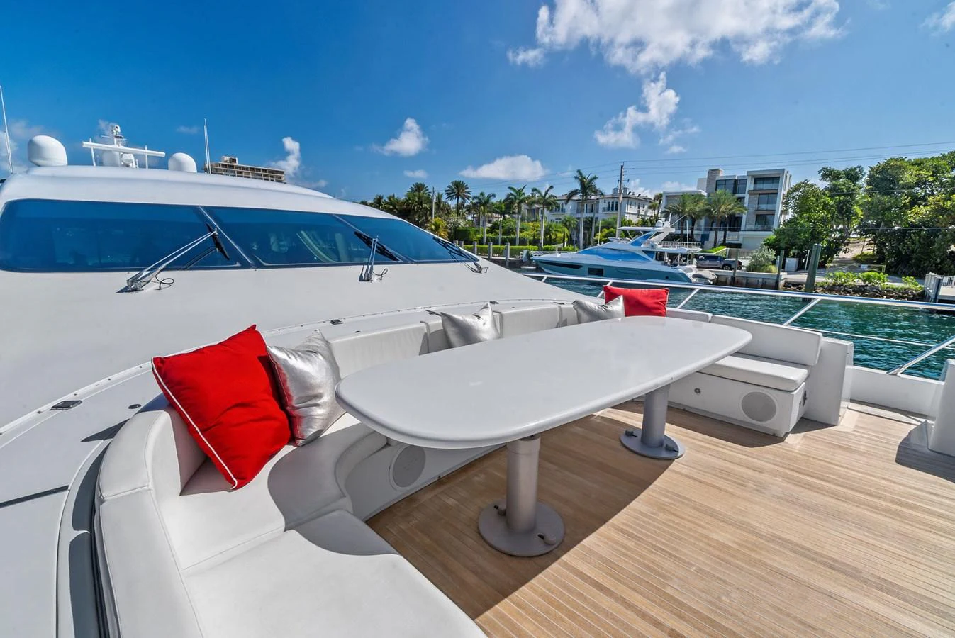 The foredeck features a spacious seating area with a table, perfect for outdoor relaxation and dining. aboard INCOGNITO Yacht for Sale