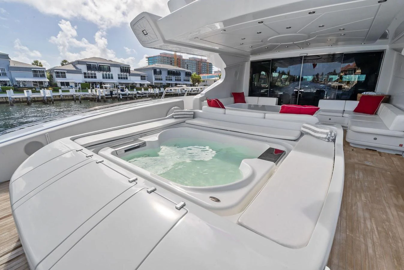 The aft deck features a luxurious jacuzzi with ample seating and scenic views. aboard INCOGNITO Yacht for Sale