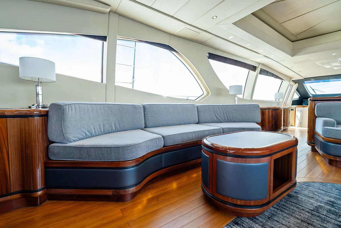 The salon features a spacious and elegant seating area with large windows providing ample natural light. aboard INCOGNITO Yacht for Sale