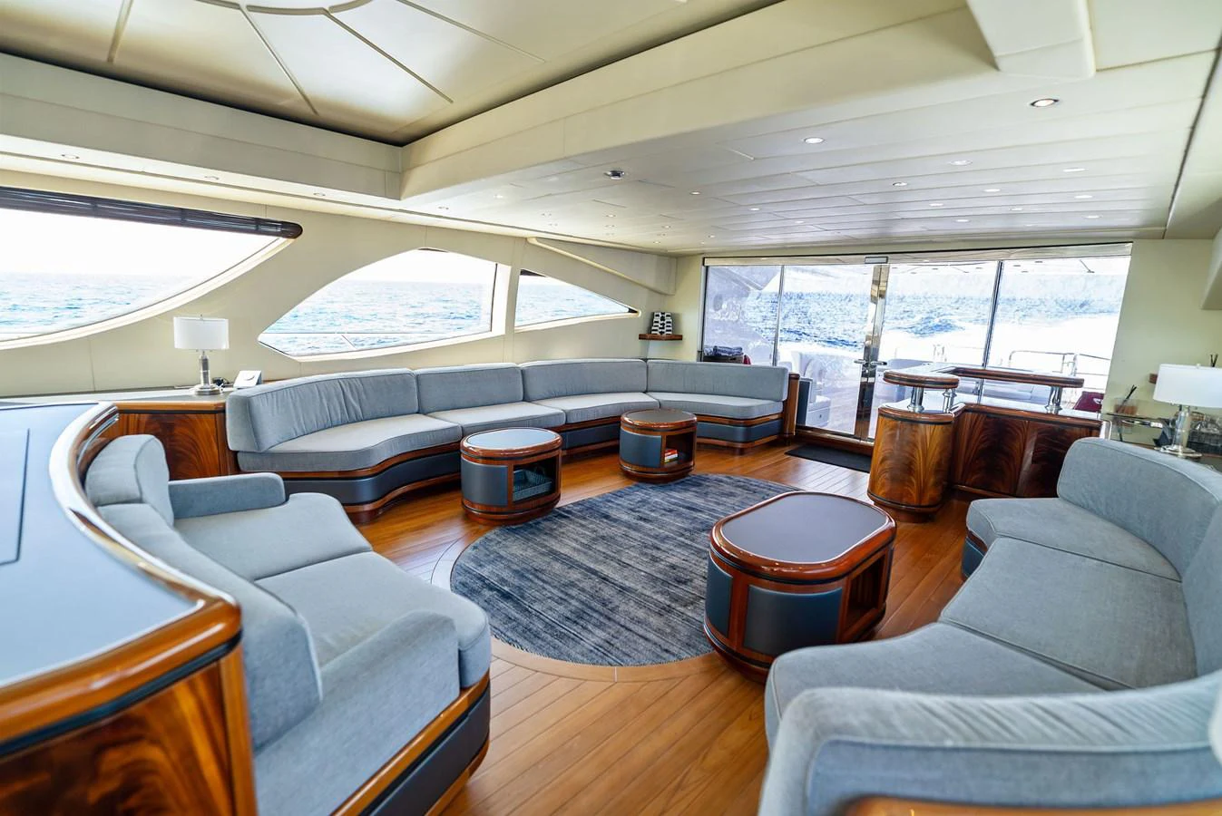 The spacious salon features plush seating and elegant wood finishes, offering a luxurious and comfortable setting for relaxation. aboard INCOGNITO Yacht for Sale