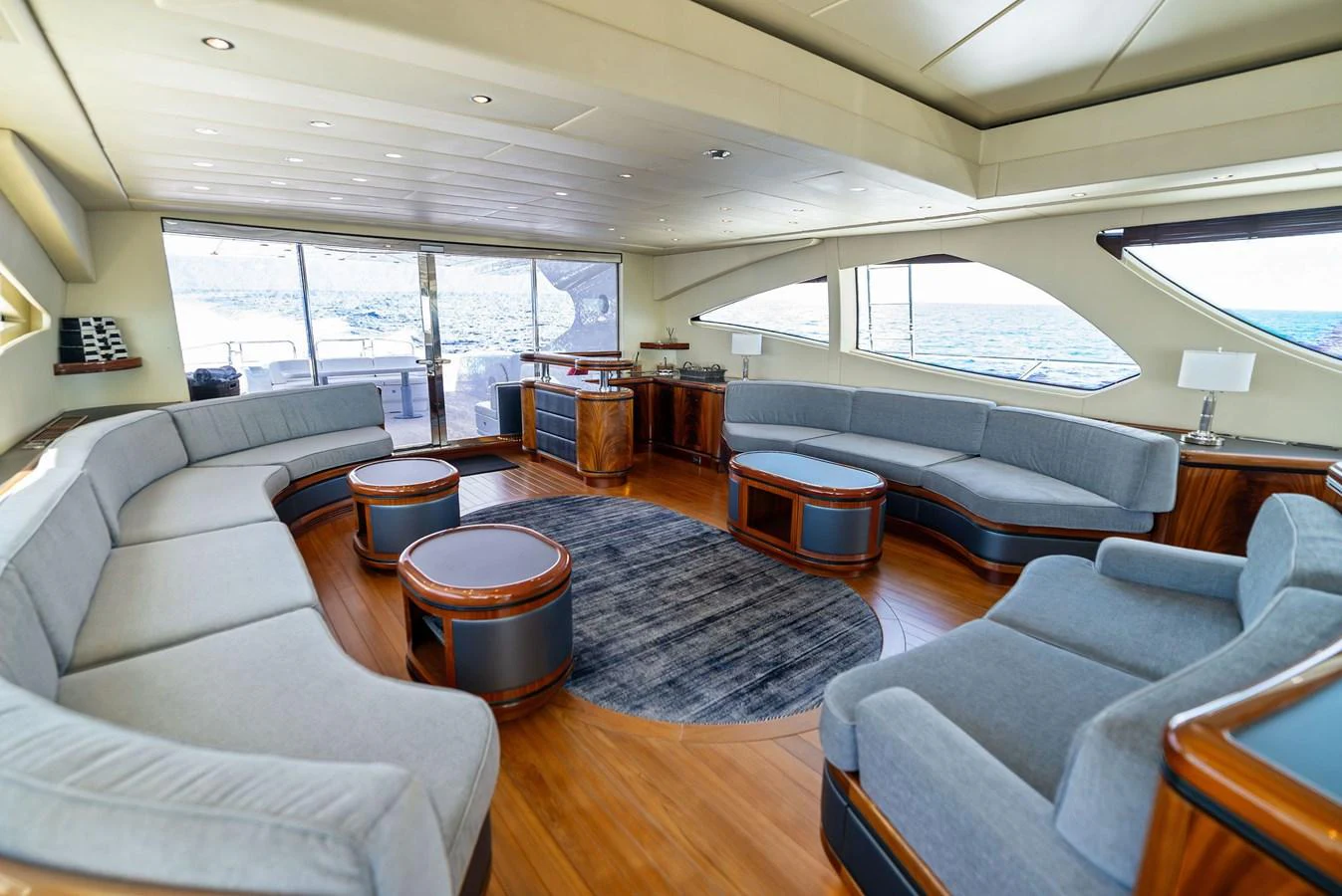 The spacious salon features elegant seating and panoramic windows for a luxurious experience. aboard INCOGNITO Yacht for Sale