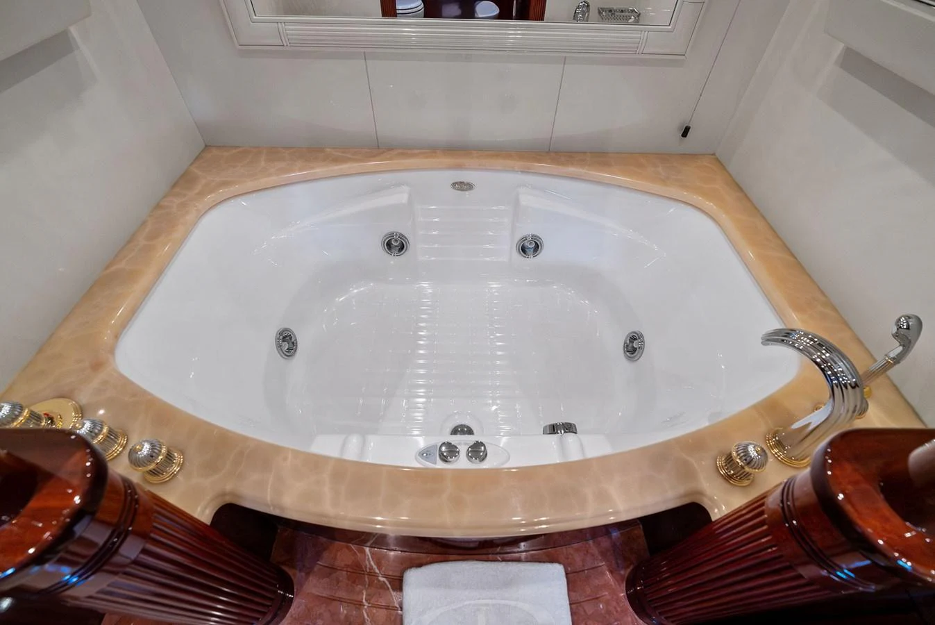 Luxurious bathroom featuring a spacious jacuzzi tub with elegant fixtures. aboard INCOGNITO Yacht for Sale