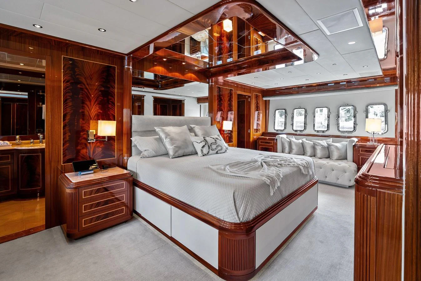 The master stateroom features luxurious wood finishes and ample natural light from multiple windows. aboard INCOGNITO Yacht for Sale