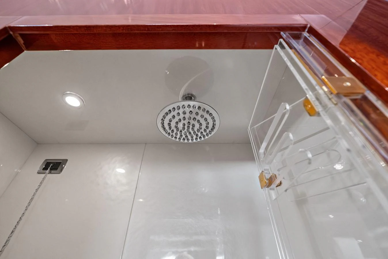 The image showcases a modern shower area with a sleek design and luxurious fixtures. aboard INCOGNITO Yacht for Sale
