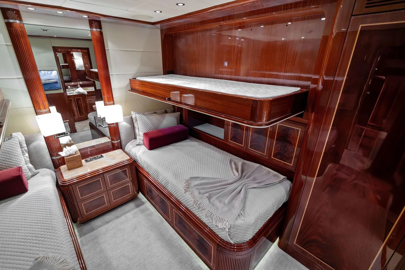 The guest stateroom features elegant wood finishes and comfortable twin beds. aboard INCOGNITO Yacht for Sale