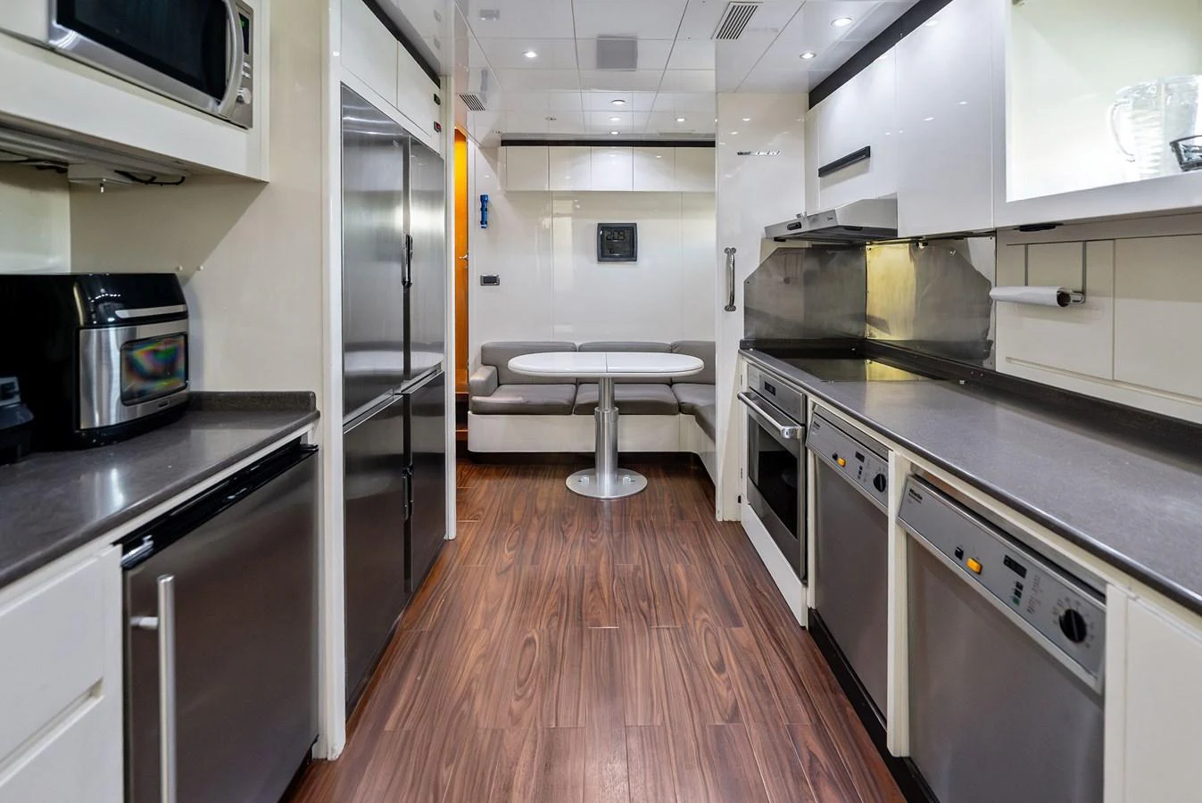 The yacht's galley is equipped with modern appliances and sleek countertops, offering a functional and stylish space for culinary activities. aboard INCOGNITO Yacht for Sale