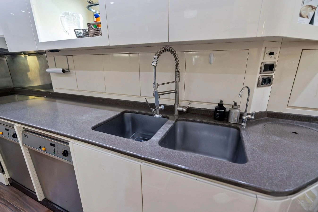The yacht's galley features modern appliances and a sleek, functional design. aboard INCOGNITO Yacht for Sale