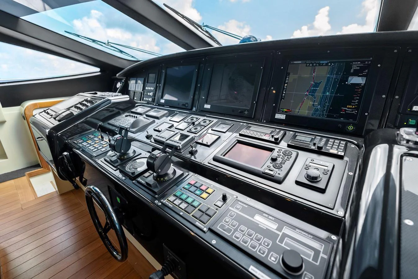 The helm station features advanced navigation and control systems with a sleek, modern design. aboard INCOGNITO Yacht for Sale