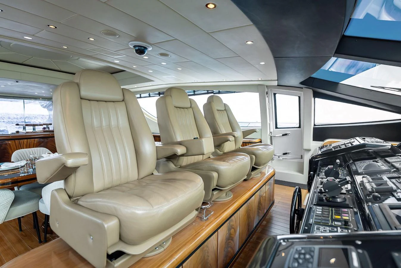 The helm station features luxurious leather captain's chairs and state-of-the-art navigation equipment. aboard INCOGNITO Yacht for Sale