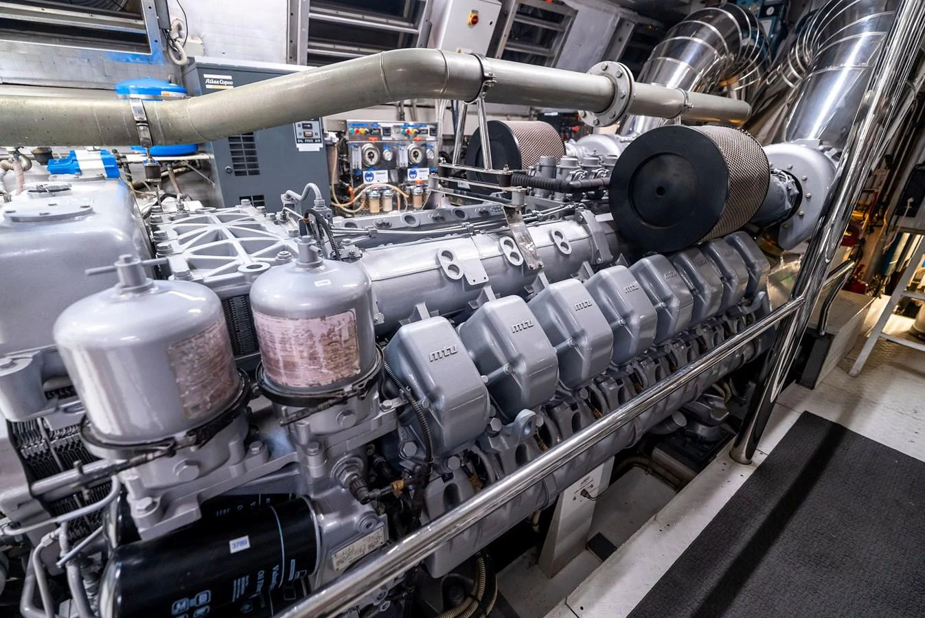 The image showcases the intricate and powerful engine room of the yacht. aboard INCOGNITO Yacht for Sale