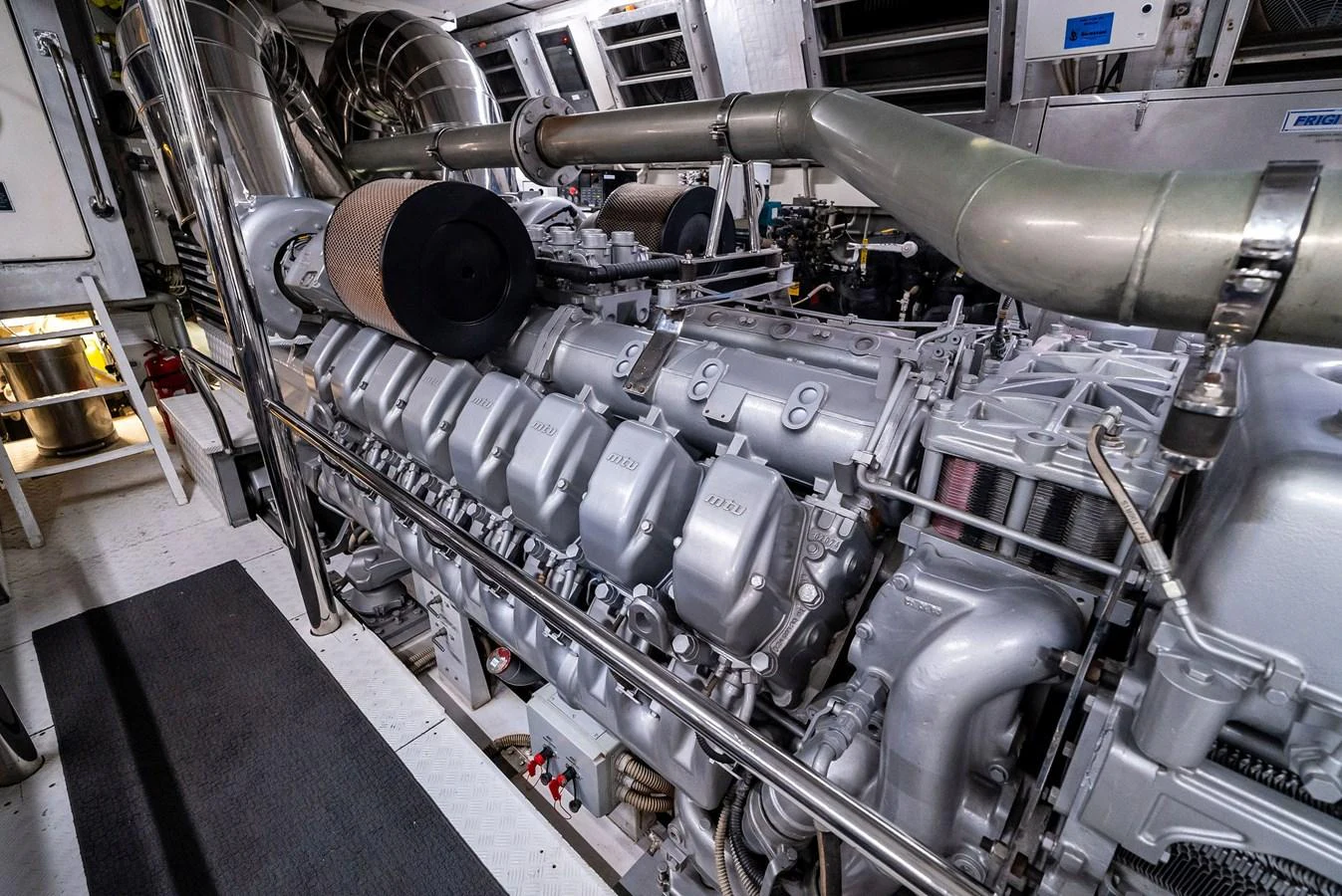 The image showcases the yacht's powerful and meticulously maintained engine room. aboard INCOGNITO Yacht for Sale